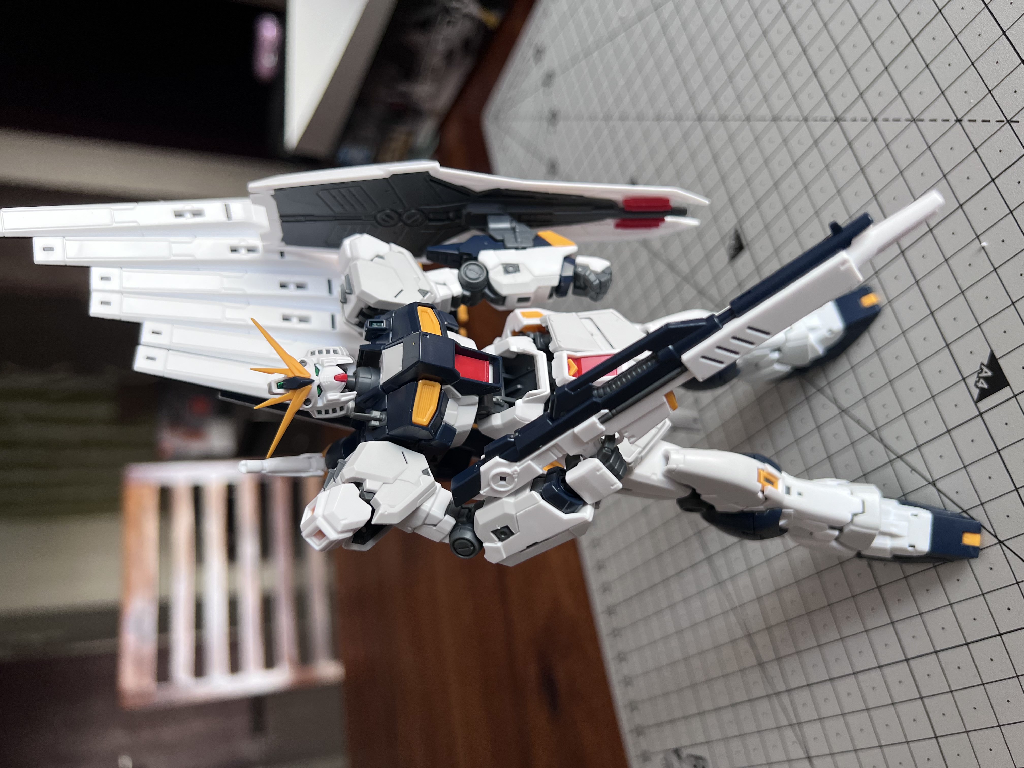 Gundam posing with beam rifle in right hand and sheild in left hand with fin funnel