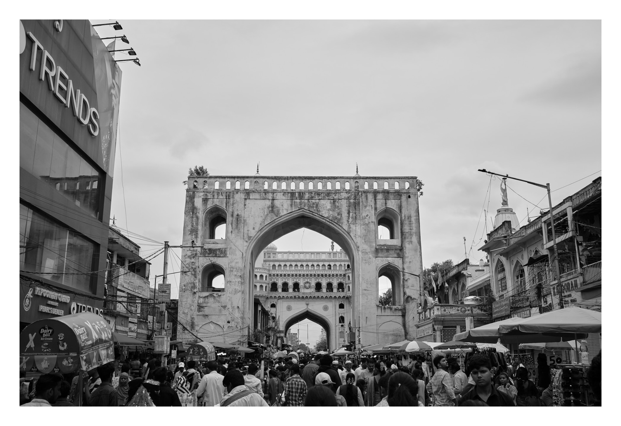 the arches of charminar's gate and charminar aligned in the same frame