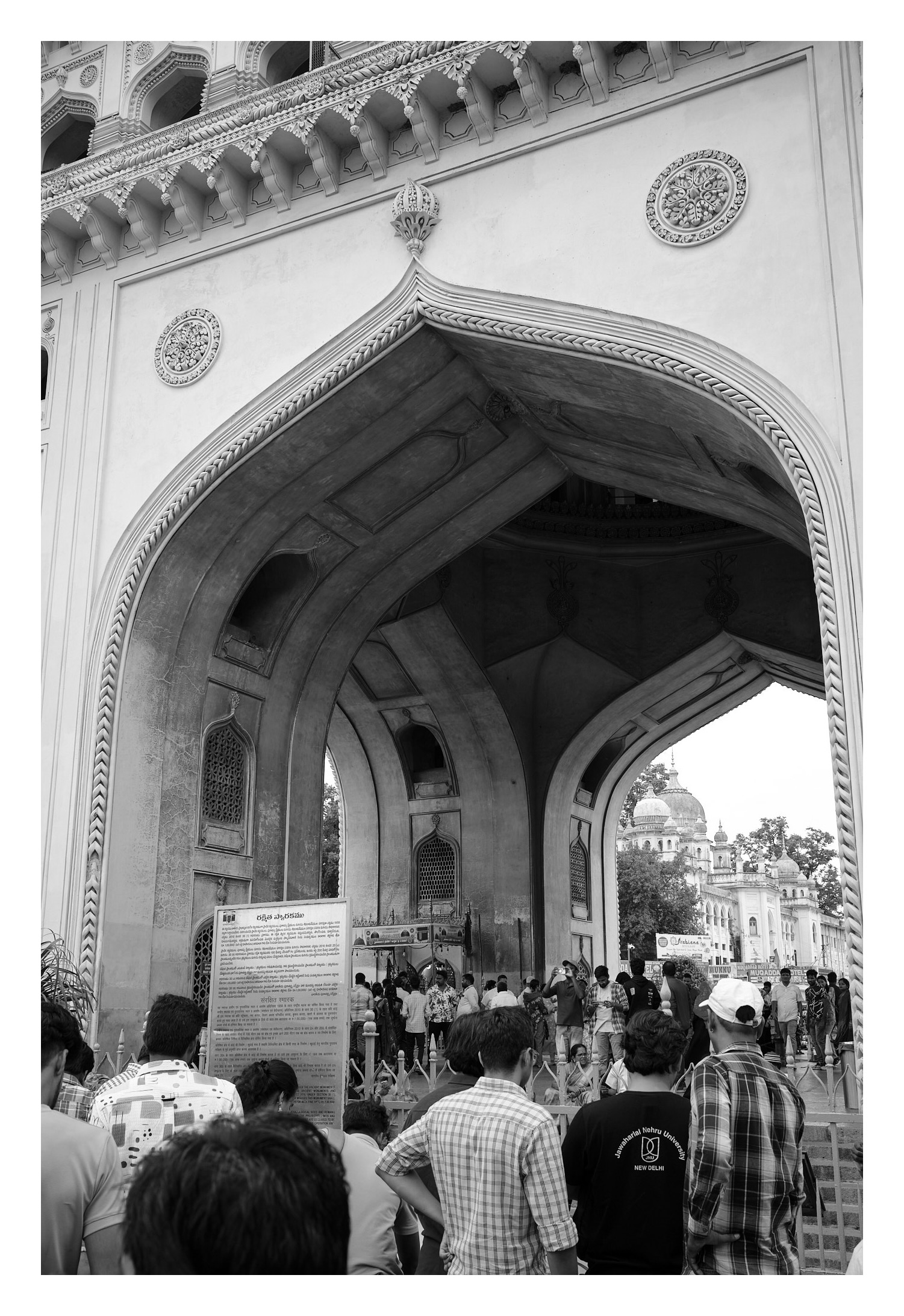 A black and white photo of Charminar's arch