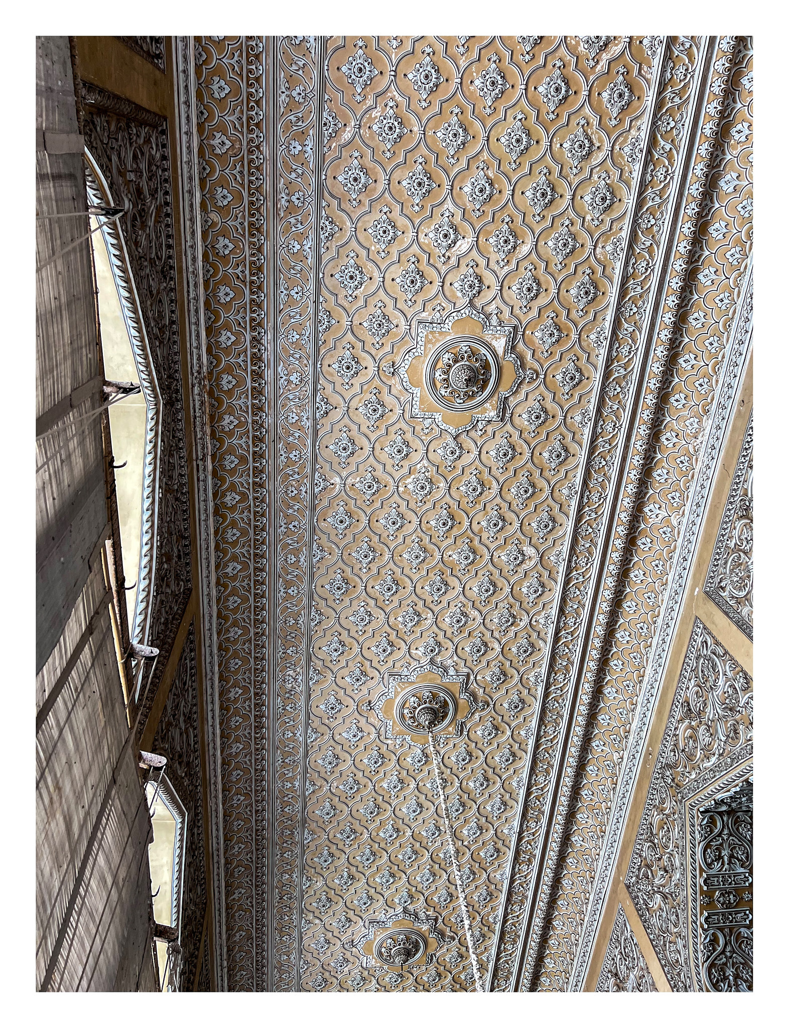 The floral ornamentation on the ceiling of Tahniyat Mahal