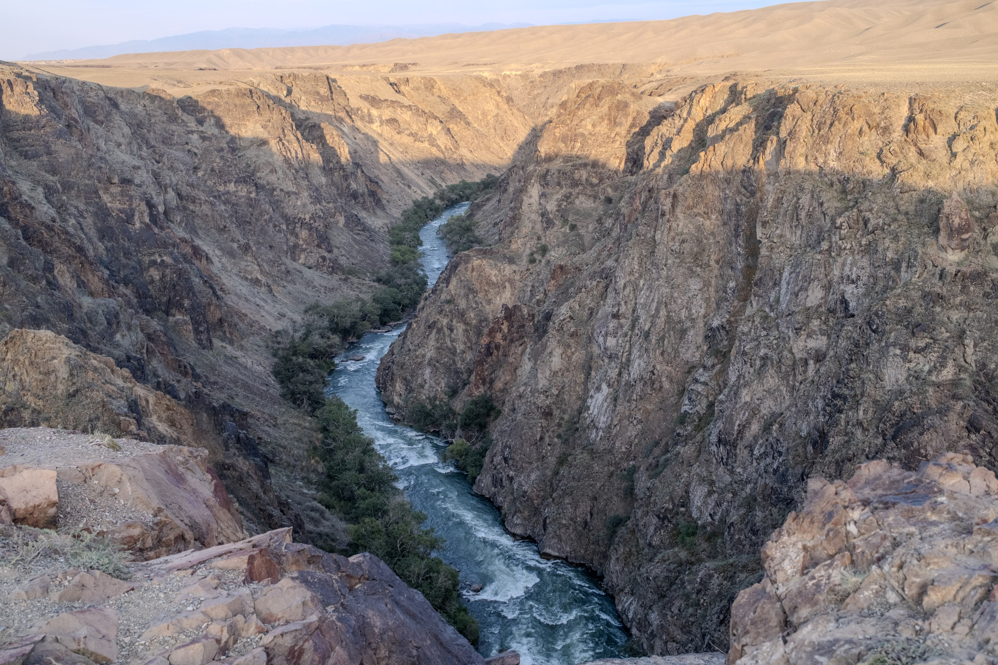 Steep canyon with river flowing in the middle