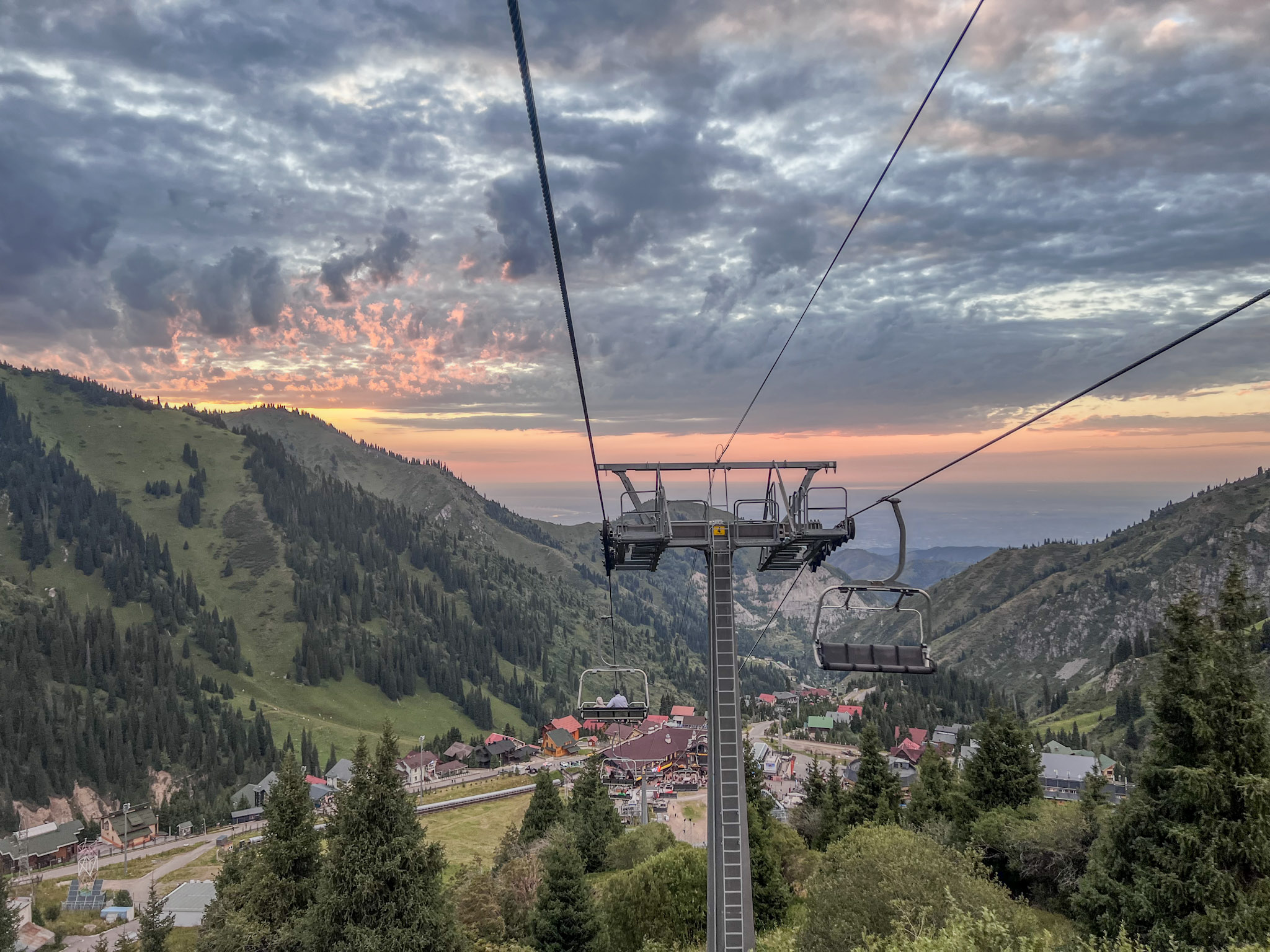 another photo of chairlift with golden sky due to sunset